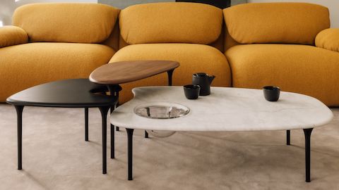 Luva Modular Sofa, and Cyclade Tables in marble, walnut, and ebony, in a living room