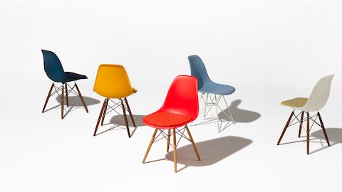 A selection of Eames Molded Shell Chairs in a variety of colors.
