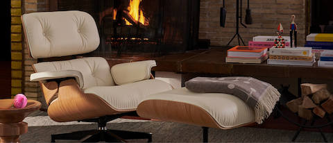 Get cozy with fireside essentials—including Eames Lounge Chair and Ottoman and the plush Girard Throw.