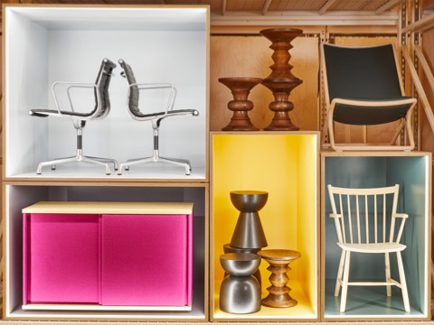 Large, colorful boxes stacked on top of each other containing furniture and accessories from Herman Miller Group. Large, colorful boxes stacked on top of each other containing furniture and accessories from Herman Miller Group.