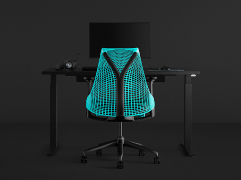Sayl Gaming Chair with a bright blue back faces an all-black gaming setup with a sit-to-stand desk and large monitor. Sayl Gaming Chair with a bright blue back faces an all-black gaming setup with a sit-to-stand desk and large monitor.