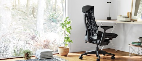 Embody Chair next to large window with view of trees. Embody Chair next to large window with view of trees.